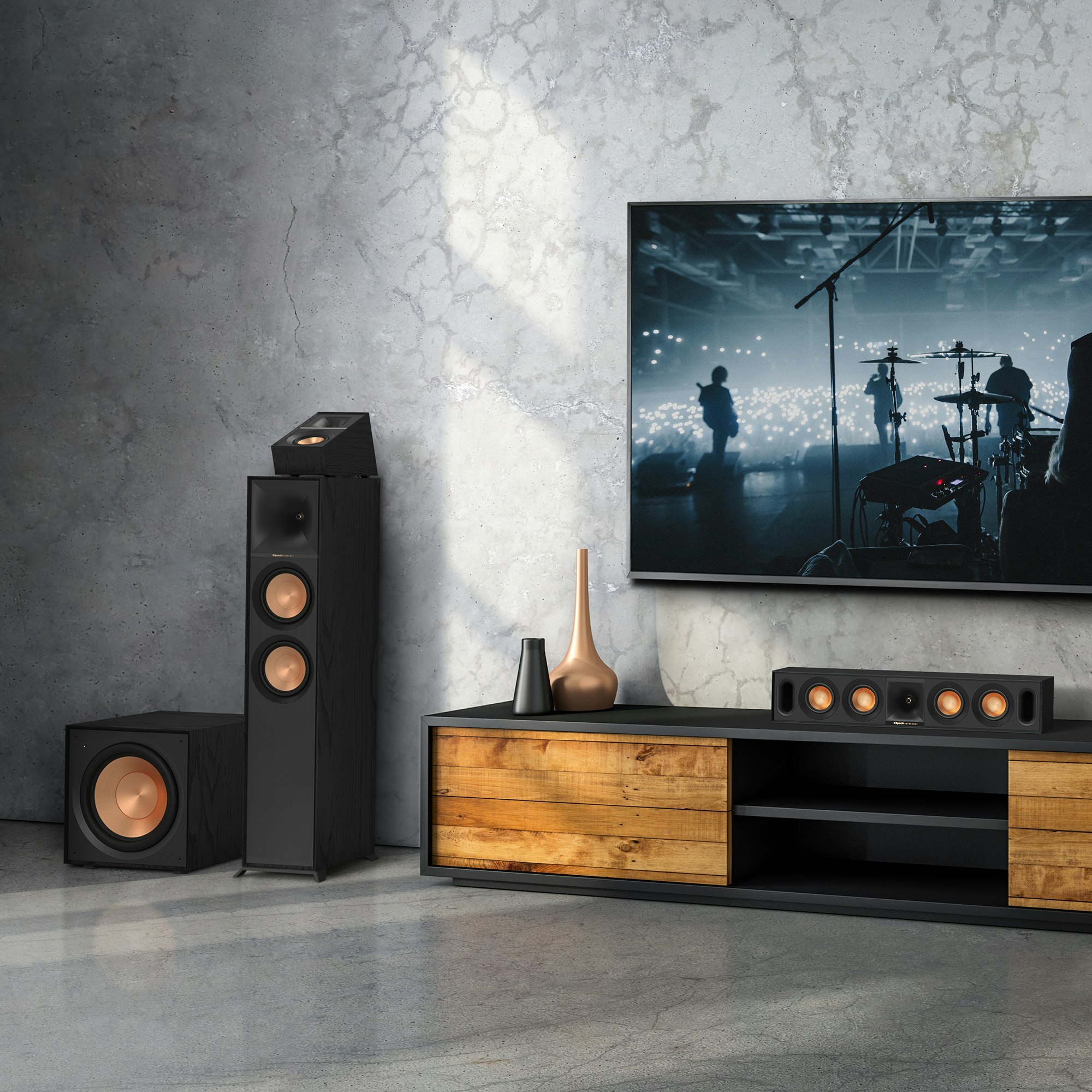 Reference Subwoofer R-101SW in a dolby atmos setting next to other Klipsch speakers and a TV